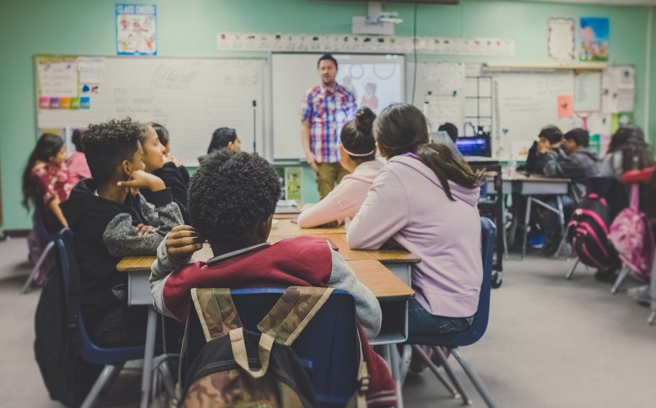 Teacher with a class of school students